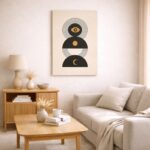 北欧ミニマルなリビング空間に飾られた、A3サイズ相当の月とシンボルモチーフの抽象アート。