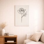 北欧ミニマルなリビング空間に飾られた、ブラックラインのフラワーフォルム 抽象アート（A3サイズ相当）。