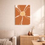 北欧ミニマルなリビング空間に飾られた、テラコッタカラーのフラワーモチーフ抽象アート（A3サイズ相当）。
