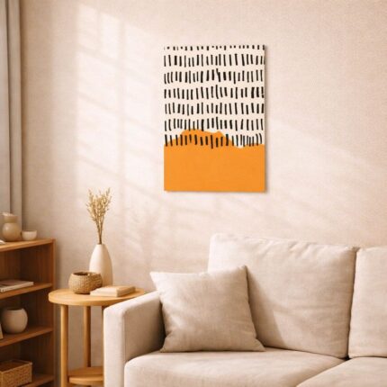 北欧ミニマルなリビング空間に飾られたブラックラインとオレンジの抽象アート（A3サイズ相当）。