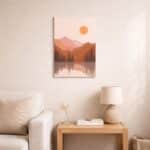 北欧ミニマルなリビング空間に飾られた、円い太陽と湖面反射を描いた抽象風景アート（A3サイズ相当）。