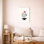 北欧ミニマルな空間に飾られたトリカラーフラワー抽象キャンバスアート（A3相当）。