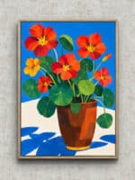 青い背景に赤橙の花と青い花瓶を描いたフラワーアートパネル フレーム設置イメージ