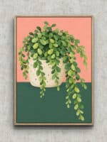淡いピンク背景に鉢植えの葉がこぼれるように広がるリーフ 壁掛けアートのアートパネル フレーム設置イメージ